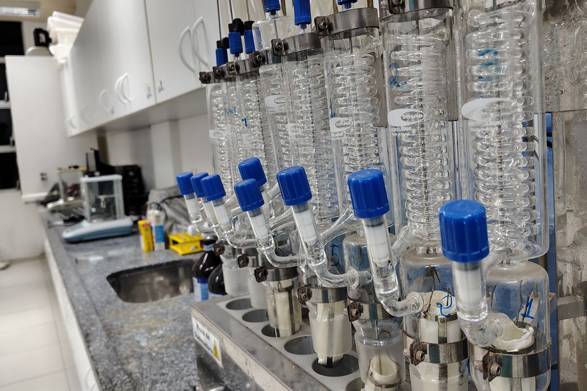 Glass condensers and glassware set up on a laboratory bench