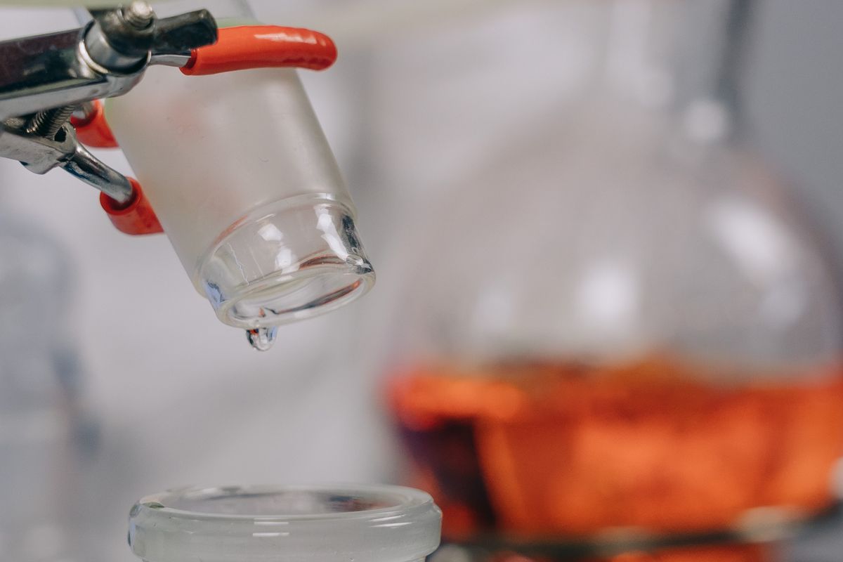 Laboratory glassware held in clamps during an experiment