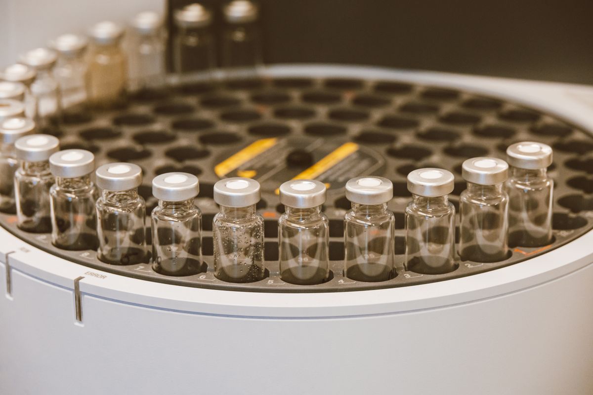 Rows of small glass vials arranged in a laboratory